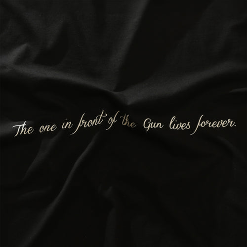 The one in front of the gun